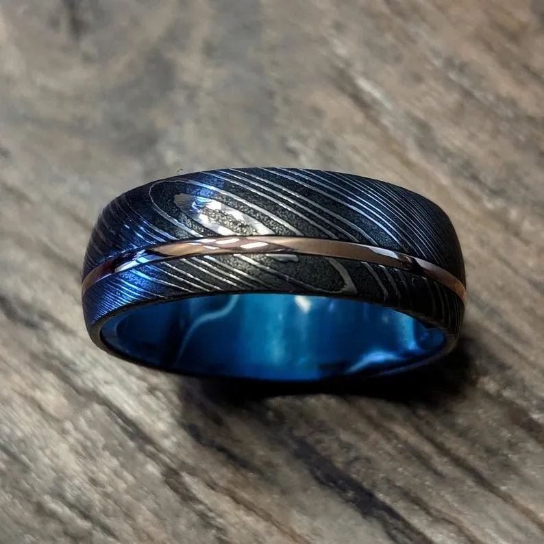 Damascus Steel Men's Wedding Band with 14k Rose Gold Inlay and Blue Ocean Sleeve